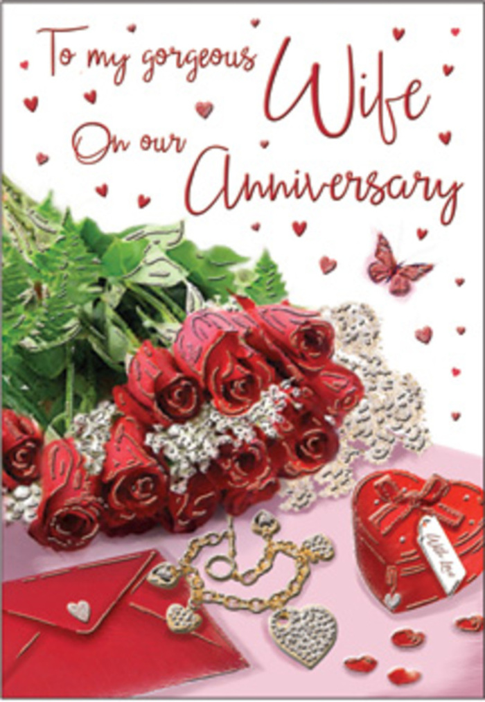 This evocative anniversary card image presents a carefully curated vignette that could easily sit on a dressing table in a Leatherhead townhouse, somewhere between the station and the historic church. Centre stage is a bouquet-like grouping of crimson roses, their petals lush, layered, and intricately curled, creating the impression that you might almost feel their velvety texture under your fingers. Deep green foliage frames the blooms, offering contrast and structure, much like a florist would when hand-tying an anniversary bouquet. Surrounding this floral centrepiece are tokens of affection that tell their own quiet story: a scarlet jewellery box adorned with a ribbon, its surface slightly glossy, and a fine gold necklace with intertwined hearts resting gracefully nearby. These jewellery elements catch small points of light, suggesting precious moments marked with gifts over the years-perhaps after walks along the River Mole or dinners in Leatherhead's local restaurants. Delicate, shimmering decorations and confetti-like specks are scattered across the backdrop, twinkling softly and echoing the curve and flow of the necklace chain. Above or around the flowers, the card's message appears in flowing, scripted lettering, gently framed by a scatter of tiny red hearts that seem to dance across the design. The lighting is warm and atmospheric, bathing everything in a gentle glow that enhances the reds, greens, and golds, while casting soft shadows that add depth. The scene feels like a tribute to long-lasting love, capturing both the grand gesture of roses and the intimate charm of little keepsakes-an ideal reflection of anniversaries celebrated quietly yet joyfully in Leatherhead.